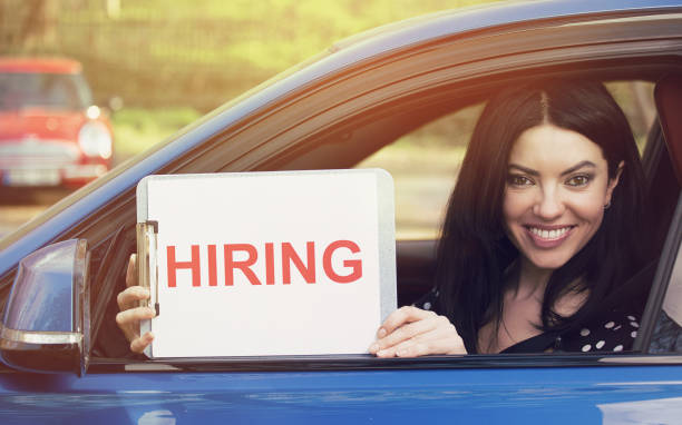 istock attractive young woman sitting inside her car 666065150