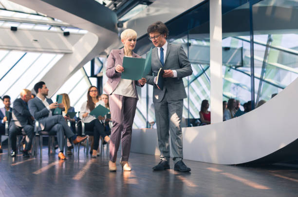 istock Mature business couple at a conference 666066144