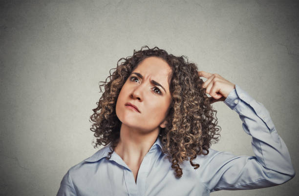 istock young woman scratching head 666068640