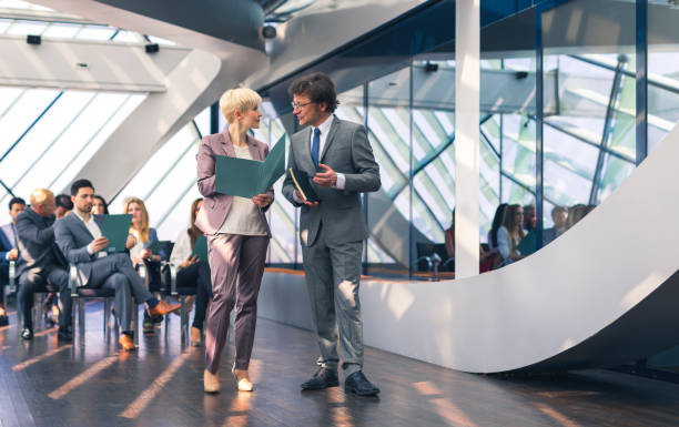 istock Mature business couple at a conference 666069130