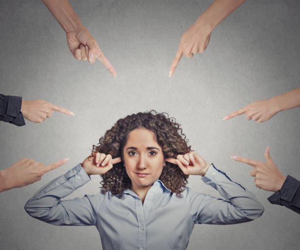 istock skeptical young curly brown hair woman 666069910