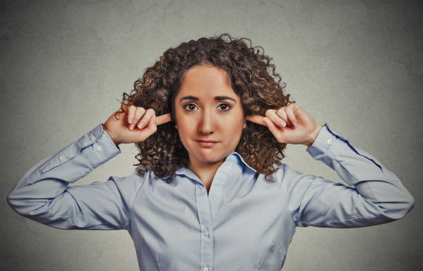 istock skeptical young curly brown hair woman 666069912