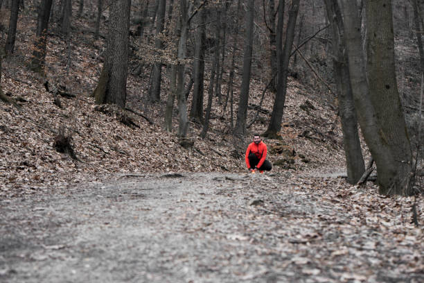 istock Runner in nature tying a shole lace 666072146