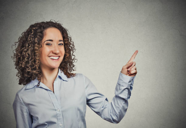 istock happy confident young smiling woman gesturing 666072260