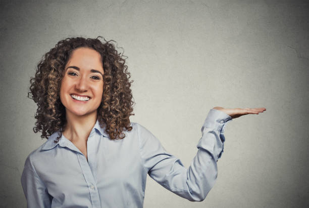istock happy confident young smiling woman gesturing 666072302