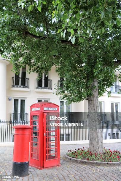 Red Telephone Cell And Mailbox In London Great Britain Stock Photo - Download Image Now