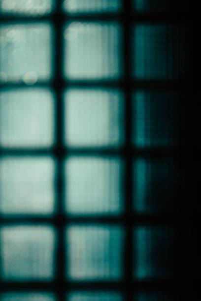 istock Green abstract blurred background. The wall of glass blocks 666085164
