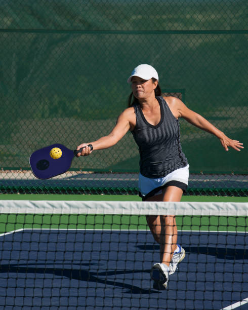 istock Pickleball - Female Player Hitting Forehand Shot 666088566