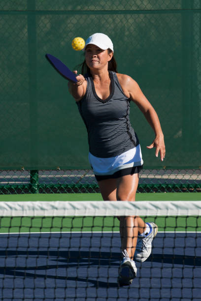 istock Pickleball - Female Player Hitting Forehand Shot 666089006