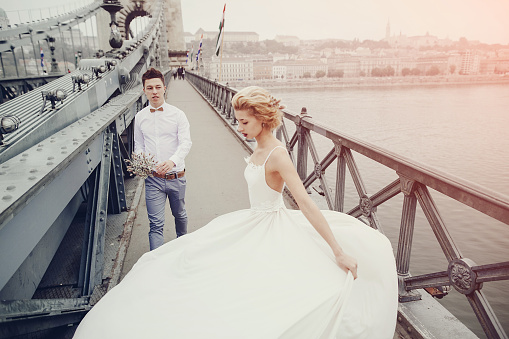 beautiful unique couple walks into your wedding day in Budapest