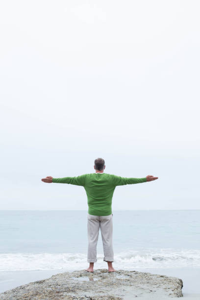 istock Man standing at the shoreline 666105386
