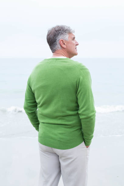 istock Man standing at the shoreline 666105434