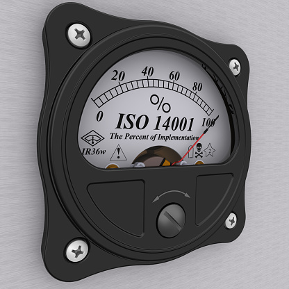 Analog indicator showing the level of implementation ISO 14001 standard (ISO 14001 sets out the criteria for an Environmental Management System (EMS)). 3D Illustration. Isolated
