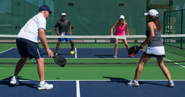 pickleball - mixed doubles play - doubles stock-fotos und bilder