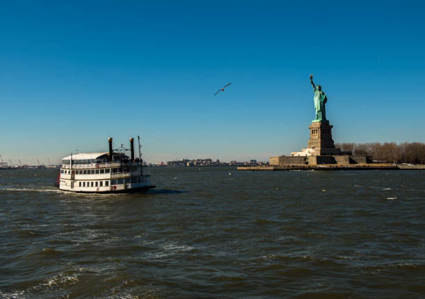 istock Libery statue with passenger ship in New York City 666116122