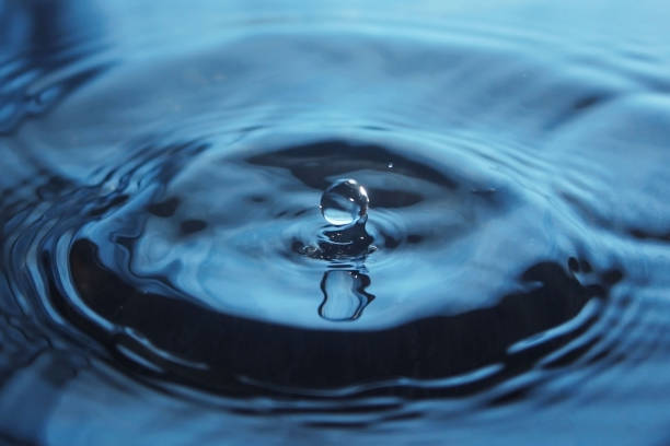 istock Water Drop impact on water surface 666123212