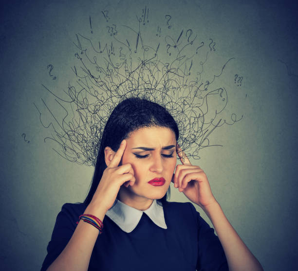 istock sad young woman with worried stressed face expression and brain melting into lines question marks 666137436