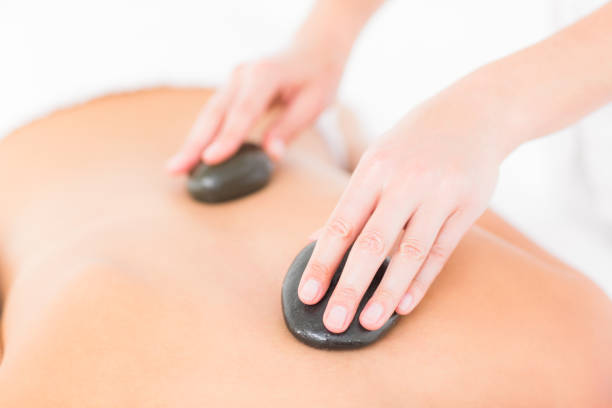 istock Woman enjoying a hot stone massage 666149914