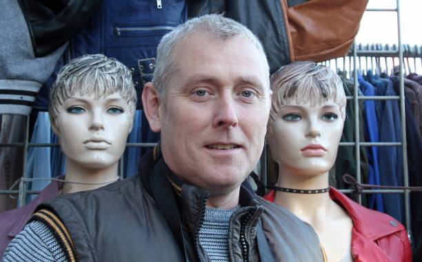 Mature man and mannequins