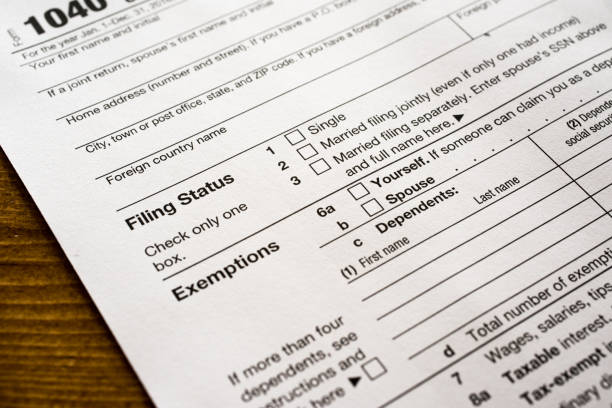 US Income tax return form 1040 filing status and exemptions stock photo