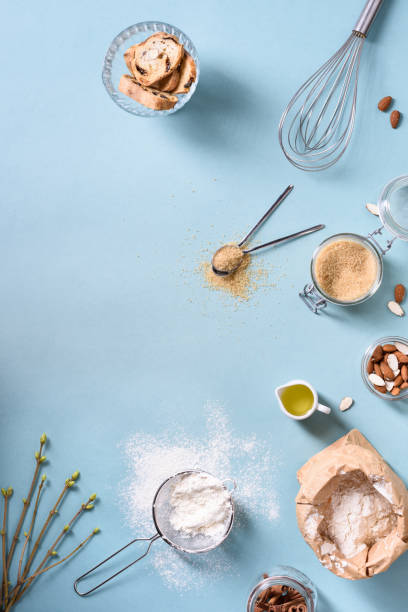 istock Cooking and baking ingredients - egg, flour, brown sugar, almonds over blue table. 666155862