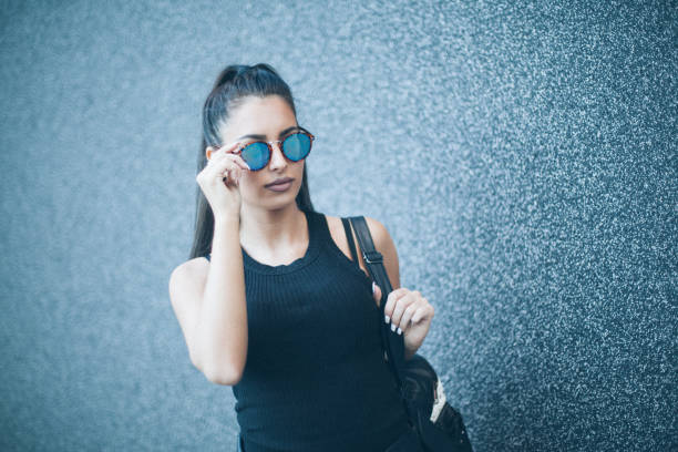 istock Young woman next to the grey wall 666159042