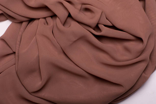 istock Background texture, brown satin fabric with folds 666171262