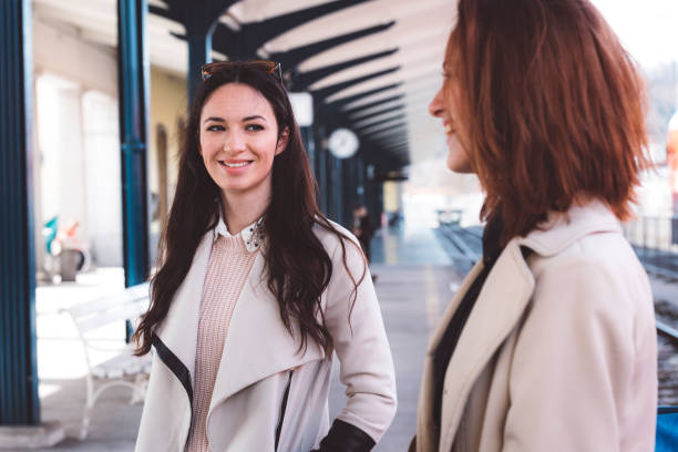 istock Two friends having fun at the train station 666175122
