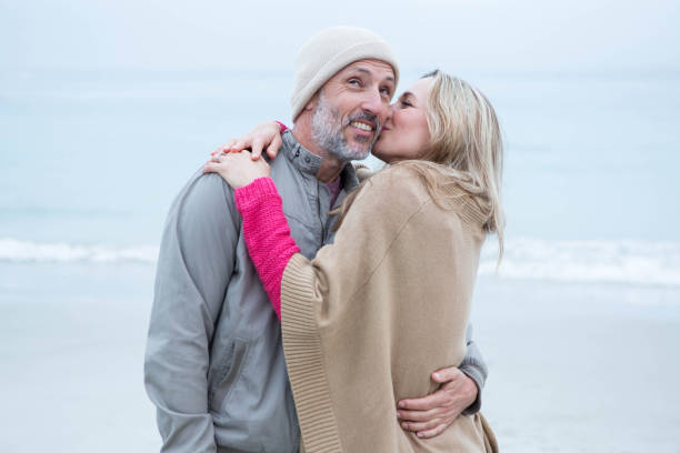 istock Cute couple standing and holding each other 666175712