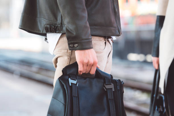 istock Trendy young male holding backpack 666177896