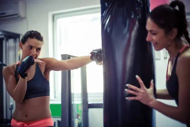 Women boxing at the gym
