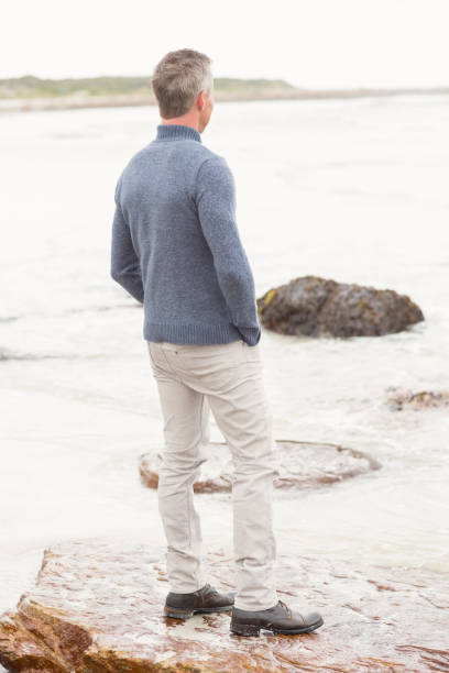 istock Man standing on a large rock 666180494