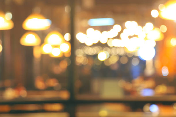Blurred cafe or restaurant with bokeh lights background