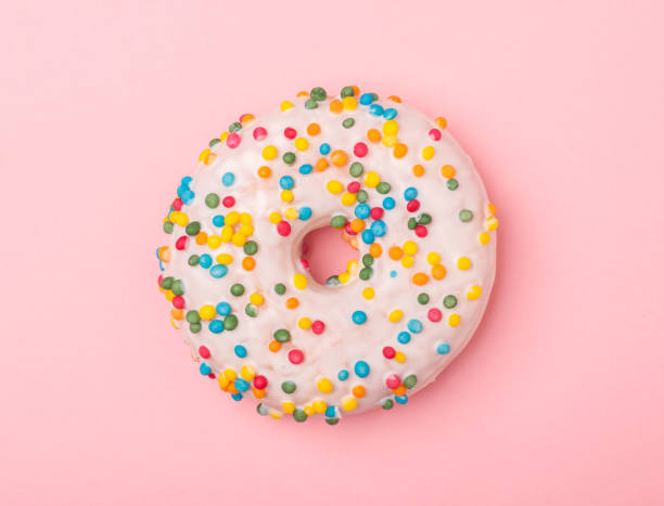 istock tasty donut isolated on pink background 666181512
