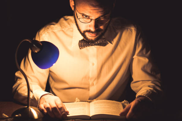 istock Young scientist working on research late night 666184030