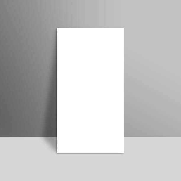 istock White blank stationary near the grey wall with shadow. Close up magazine, book, brochure, flyer, a4 letterhead, folder, leaflet, booklet 666186942