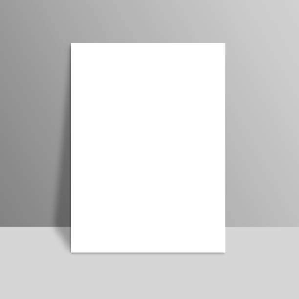istock White blank stationary near the grey wall with shadow. Close up magazine, book, brochure, flyer, a4 letterhead, folder, leaflet, booklet 666186978