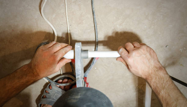 istock Plumber weld two pieces of white polypropylene pipes. View first person 666187716