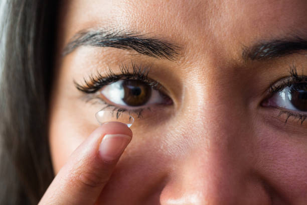 istock Smiling woman with a contact lens 666187776
