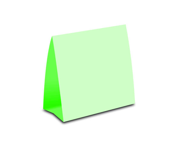 istock Blank Green Table Tent on white. Paper vertical cards isolated on white background 666190216