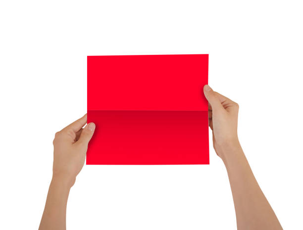 istock Hands holding blank red brochure booklet in the hand. Leaflet presentation. Pamphlet hand man. Show offset paper. Sheet template. Book in hands. Booklet folding design. Fold paper sheet display read 666190380
