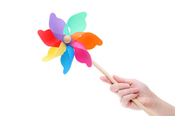 istock Hand holding colorful toy pinwheel 666190754