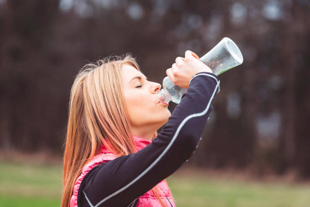 istock Closeup of a beautiful girl drinking water 666190864