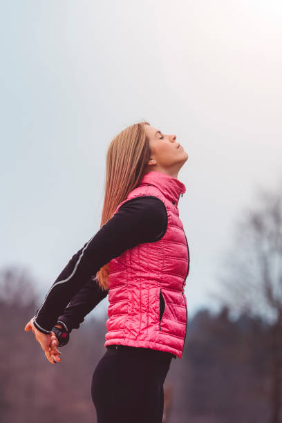istock Girl stretching her arms in the park 666193740
