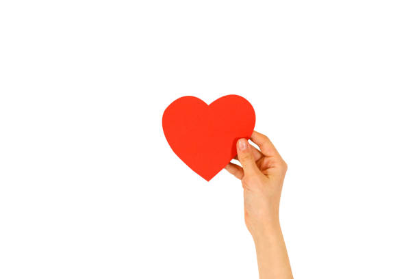istock Female hand holding empty red Valentines card with heart on a white background 666208512
