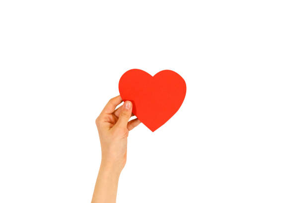 istock Female hand holding empty red Valentines card with heart on a white background 666208522