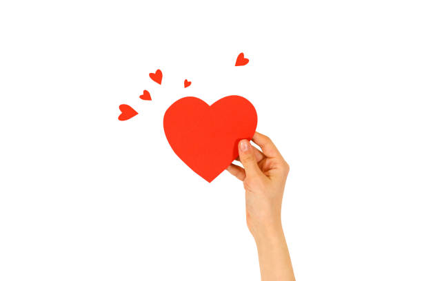istock Female hand holding empty red Valentines card with heart on a white background 666208532