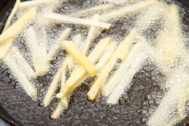 istock French fries are fried in a pan 666220614