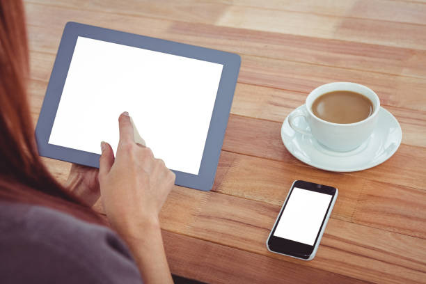 istock Over shoulder view of hipster woman using tablet 666222730