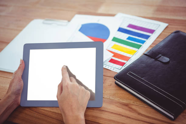 istock Over shoulder view of hipster woman using tablet 666222766